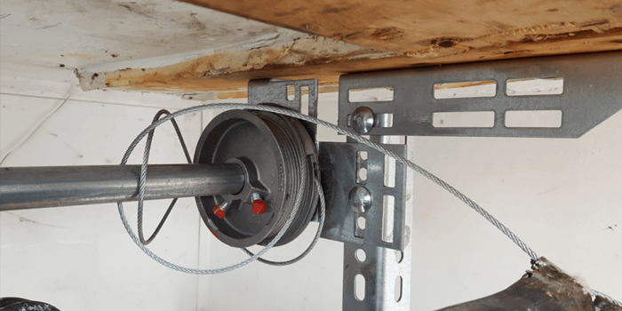 Caulfeild fix garage door cable